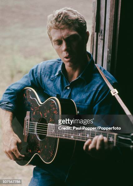 American actor Steve McQueen playing a guitar, 1965. News Photo - Getty ...