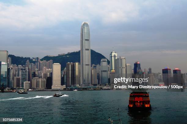 hong kong view from avenue of stars - mary dimitropoulou stock pictures, royalty-free photos & images