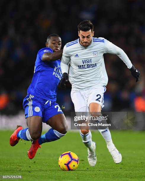 Victor Camarasa of Cardiff City is tackled by Nampalys Mendy of Leicester City during the Premier League match between Leicester City and Cardiff...