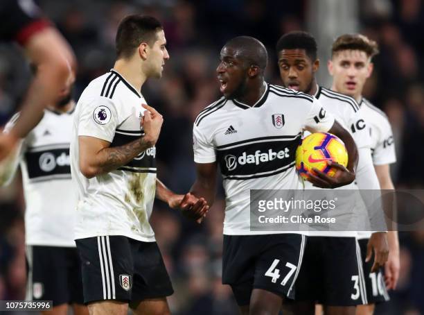 Aboubakar Kamara of Fulham argues with Aleksandar Mitrovic of Fulham over who will take the penalty ahead of Aboubakar Kamara of Fulham taking the...
