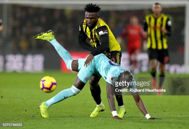 Isaac Success of Watford battles for possession with Mohamed Diame of Newcastle United during the Premier League match between Watford FC and...