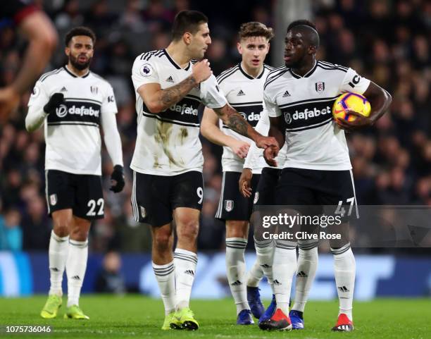 Aboubakar Kamara of Fulham argues with Aleksandar Mitrovic of Fulham over who will take the penalty ahead of Aboubakar Kamara of Fulham taking the...