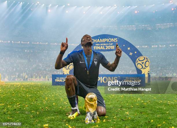 Paul Pogba of France celebrates with the World Cup Trophy following his sides victory in the 2018 FIFA World Cup Final between France and Croatia at...