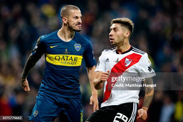 Dario Benedetto of Boca Juniors pulls a face at Gonzalo Montiel of River Plate as he celebrates after scoring his team's first goal during the second...
