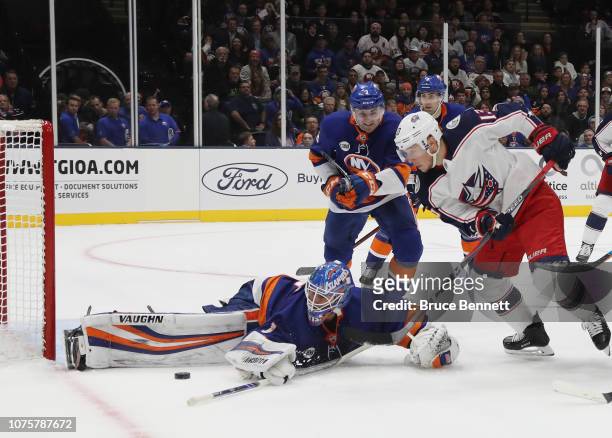 Thomas Greiss of the New York Islanders makes the third period save on Cam Atkinson of the Columbus Blue Jackets at the Nassau Veterans Memorial...