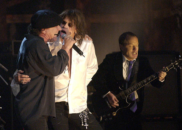 Brian Johnson and Angus Young of AC/DC with Steven Tyler