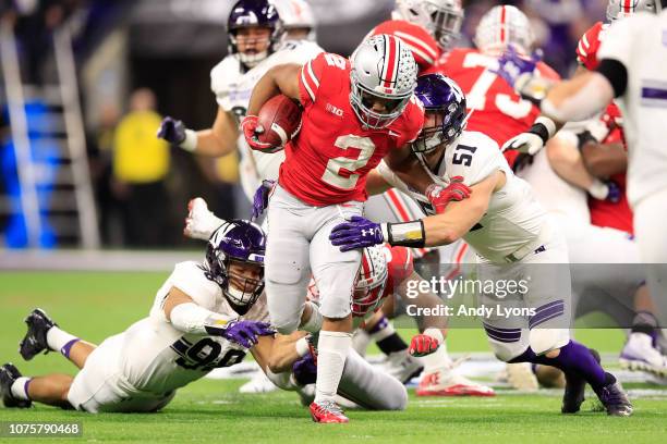 Dobbins of the Ohio State Buckeyes runs the ball in the game against the Northwestern Wildcats in the second quarter at Lucas Oil Stadium on December...