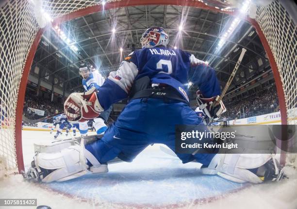 Santeri Virtanen of Finland scores on Samuel Hlavaj of Slovakia at the IIHF World Junior Championships at the Save-on-Foods Memorial Centre on...