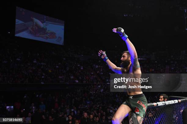 Michael Chiesa celebrates his submission victory over Carlos Condit in their welterweight bout during the UFC 232 event inside The Forum on December...