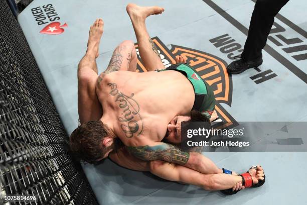 Michael Chiesa submits Carlos Condit in their welterweight bout during the UFC 232 event inside The Forum on December 29, 2018 in Inglewood,...