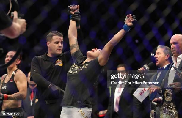 Amanda Nunes of Brazil celebrates after defeating Cris Cyborg of Brazil in their women's featherweight bout during the UFC 232 event inside The Forum...