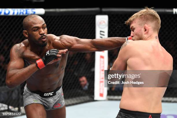 Jon Jones punches Alexander Gustafsson of Sweden in their light heavyweight bout during the UFC 232 event inside The Forum on December 29, 2018 in...