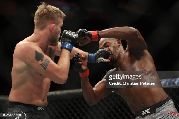 Alexander Gustafsson of Sweden punches Jon Jones in their light heavyweight bout during the UFC 232 event inside The Forum on December 29, 2018 in...