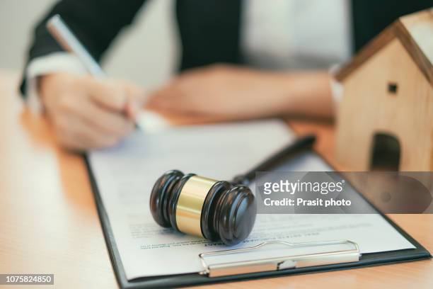 real estate concept, judge gavel and lawyer in auction with house model. - auktion stock pictures, royalty-free photos & images
