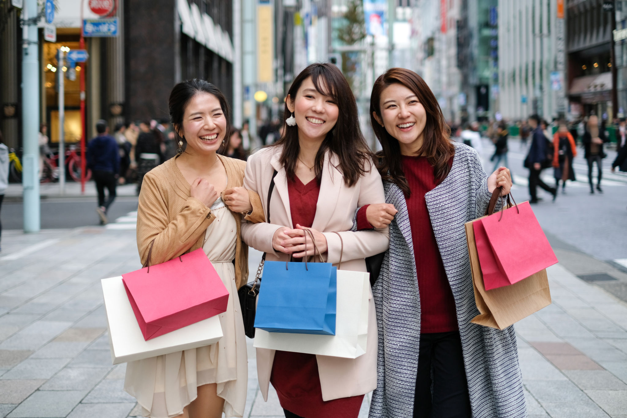 Portrait of three women shopping on street Portrait of three women shopping on street