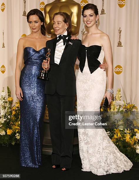 Milena Canonero , winner Best Costume Design for "Marie Antoinette", with presenters Emily Blunt and Anne Hathaway