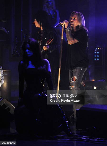 Nikki Sixx and Vince Neil of Motley Crue perform at "The Late Show with David Letterman" to promote their new album "Saints of Los Angeles" and to...