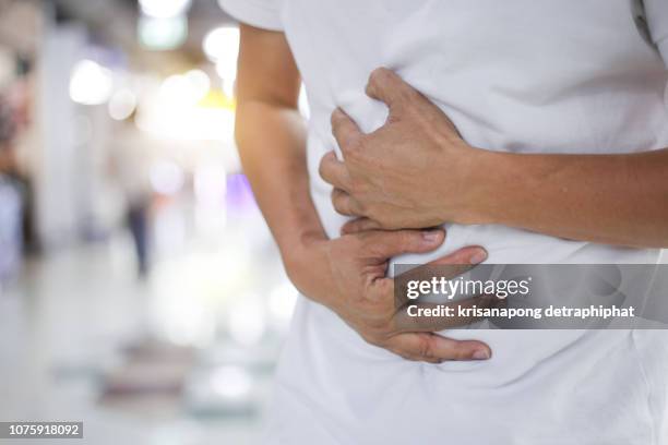 businessman stomachache - intestines stock pictures, royalty-free photos & images