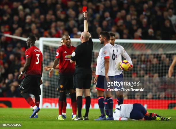 Ashley Young of Manchester United appeals as Eric Bailly of Manchester United is shown a red card and is sent off by referee Lee Mason during the...