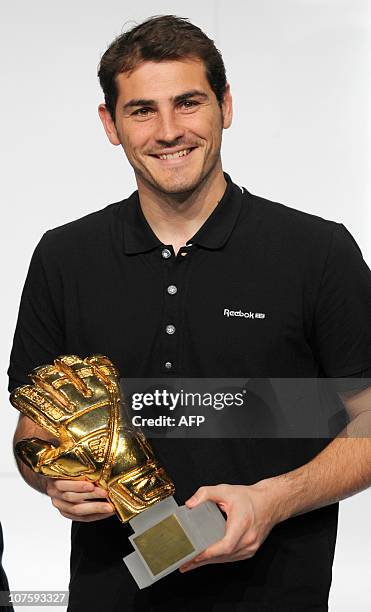 Spain's goalkeeper Iker Casillas, Golden Glove winner, poses with his award during the FIFA Soccer World Cup 2010 award ceremony at the headquarters...