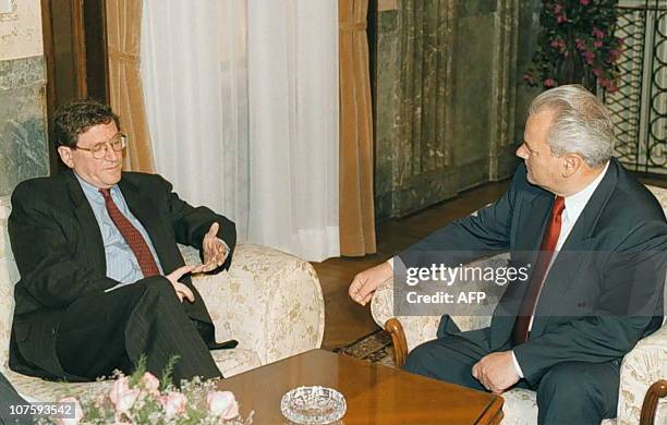 Envoy Richard Holbrooke talks with Serbian President Slobodan Milosevic in Belgrade 17 July for talks aimed at pressuring the Serbian leader into...