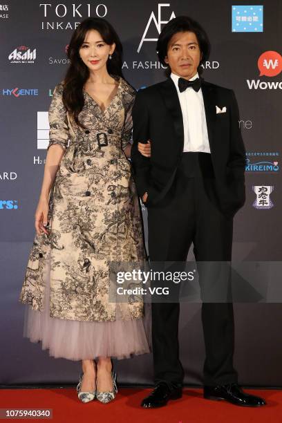 Japanese actor Takuya Kimura and Chinese actress Lin Chi-ling pose backstage during the Asia Fashion Award 2018 at Chiang Kai-shek Memorial Hall on...