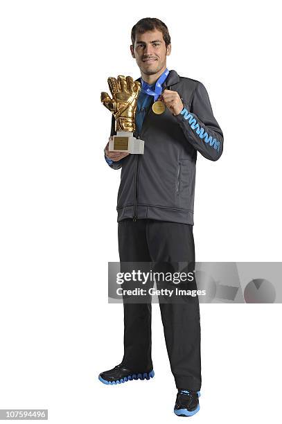 Iker Casillas of Spain poses with the adidas Golden Glove Winner Trophy at the adidas HQ on December 14, 2010 in Herzogenaurach, Germany.