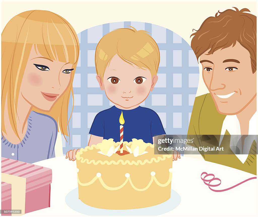 Parents watching son blow out candle on cake