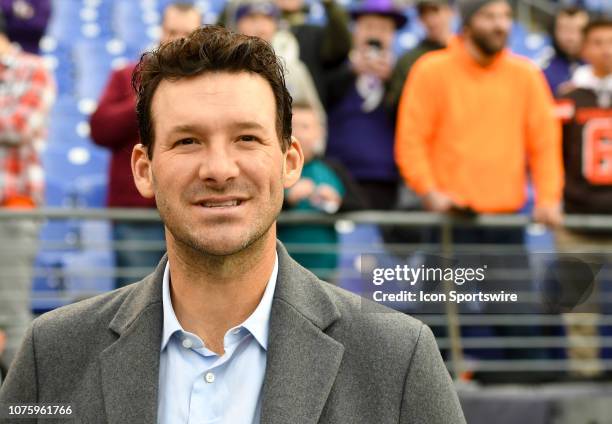 American broadcaster and former NFL quarterback, Tony Romo watches the Cleveland Browns and the Baltimore Ravens warm up prior to their game on...