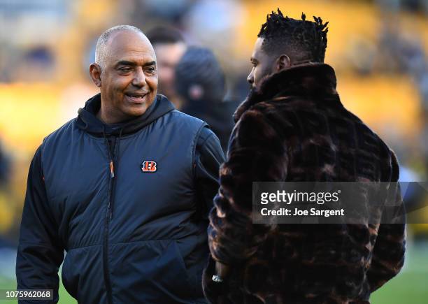 Head coach Marvin Lewis of the Cincinnati Bengals talks with Antonio Brown of the Pittsburgh Steelers before the game at Heinz Field on December 30,...