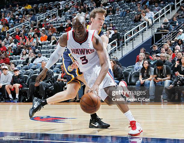 Damien Wilkins of the Atlanta Hawks against Mike Dunleavy of the Indiana Pacers at Philips Arena on December 11, 2010 in Atlanta, Georgia. NOTE TO...