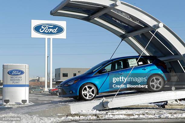 New 2012 Ford Motor Co. Focus sedan sits outside of the company's Michigan Assembly Plant in Wayne, Michigan, U.S., on Tuesday, Dec. 14, 2010. The...