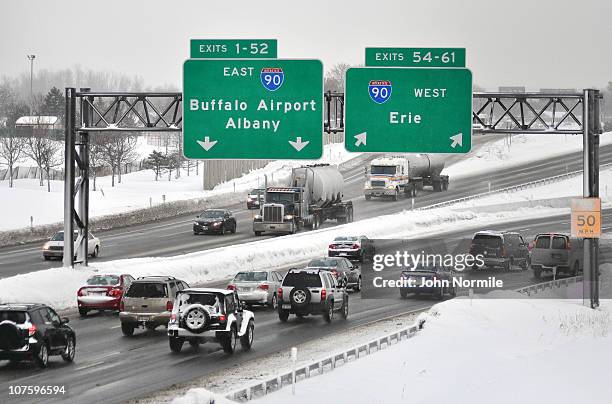 Traffic slows while entering the New York state Thruway as lake effect snow bands again set up on December 14, 2010 in Buffalo, New York.