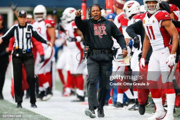 Head coach Steve Wilks of the Arizona Cardinals looks for a flag during the first quarter against the Seattle Seahawks at CenturyLink Field on...