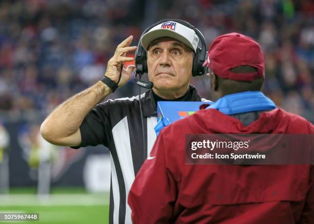 Referee Pete Morelli makes a ruling after Houston Texans head coach Bill O'Brien challenged his call during the football game between the...