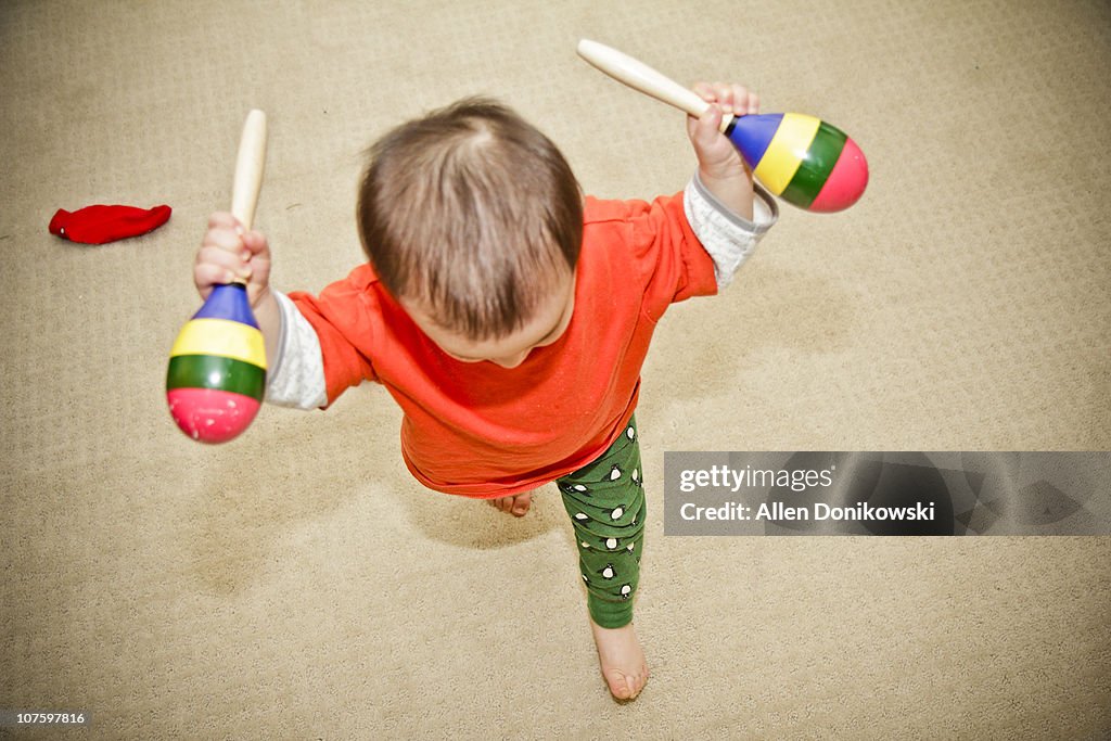 Toddler_in_motion_running_with_maracas