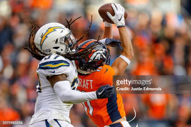 Wide receiver River Cracraft of the Denver Broncos comes up with a catch and first down under coverage by strong safety Jahleel Addae of the Los...