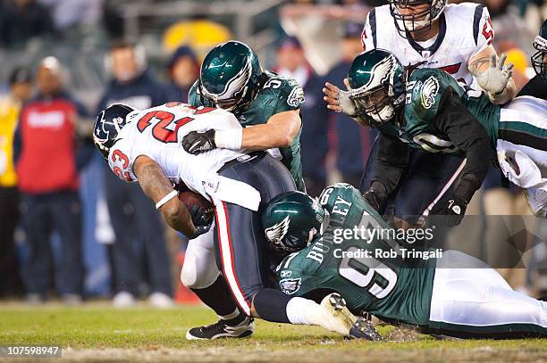 Running back Arian Foster of the Houston Texans runs with the ball against the defense of the Philadelphia Eagles during the game at Lincoln...