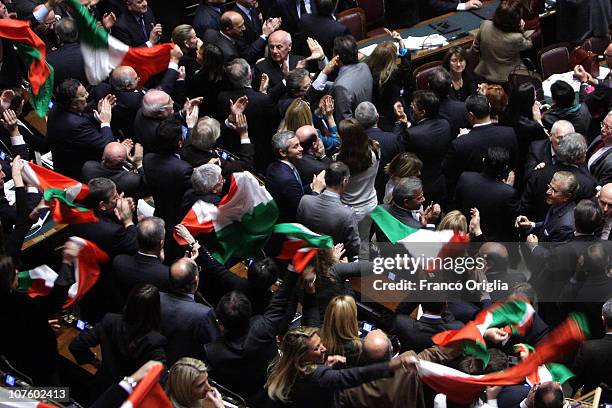 Ministers and deputies of Silvio Berlusconi's government celebrate at the end of the confidence vote in the Lower house on December 14, 2010 in Rome,...