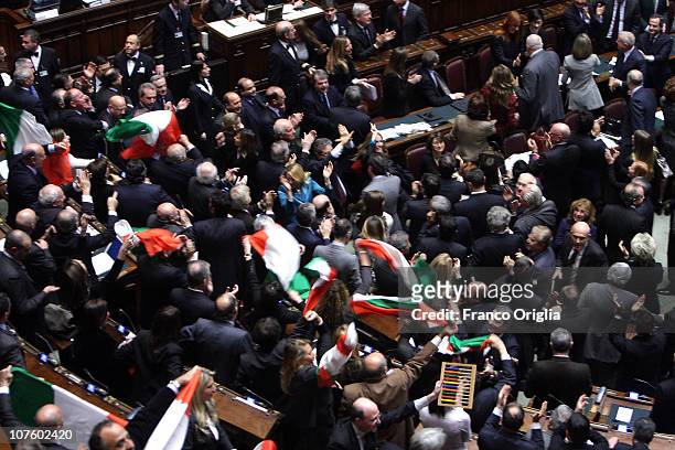 Ministers and deputies of Silvio Berlusconi's government celebrate at the end of the confidence vote in the Lower house on December 14, 2010 in Rome,...