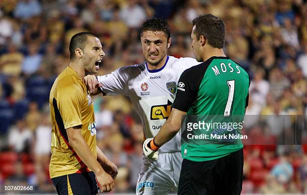 Marko Jesic of the Jets and Glen Moss of the Gold Coast are separated by Dino Djulbic of the Gold Coast after clashing during the round 18 A-League...