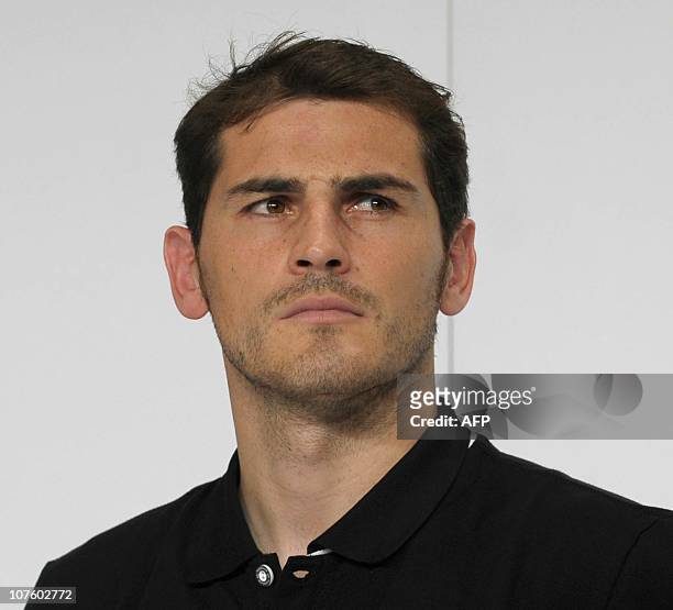 Golden Glove winner Spain's goalkeeper Iker Casillas follows the FIFA Football World Cup 2010 award ceremony at the headquarters of German sportswear...