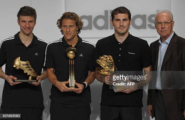 Golden Boot winner Germany's striker Thomas Mueller, Golden Ball winner Uruguay's striker Diego Forlan, Golden Glove winner Spain's goalkeeper Iker...