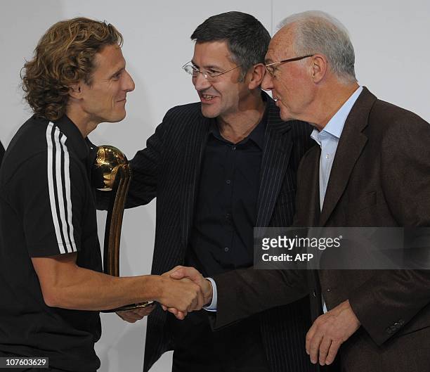 Of the German sportswear and equipment group Adidas Herbert Hainer and German football legend and FIFA executive committee member Franz Beckenbauer...
