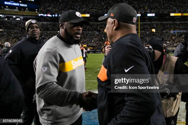 Pittsburgh Steelers head coach Mike Tomlin and Cincinnati Bengals head coach Marvin Lewis shake hands after the ball during the NFL football game...