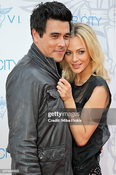 James Stewart and Jessica Marais arrive for an exclusive Bon Jovi concert at Star City on December 15, 2010 in Sydney, Australia.