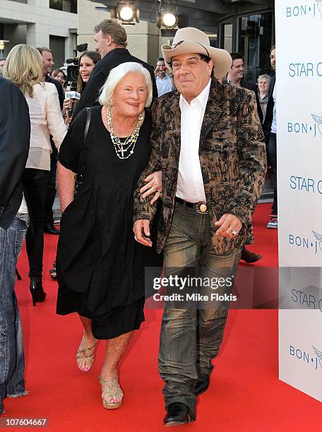 Molly Meldrum and guest arrive for an exclusive Bon Jovi concert at Star City on December 15, 2010 in Sydney, Australia.