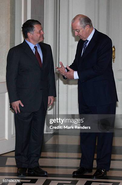 King Abdullah II bin Al-Hussein of Jordan and King Albert II of Belgium speak ahead of their lunch at Laeken Castle on December 15, 2010 in Brussels,...