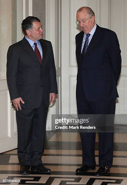 King Abdullah II bin Al-Hussein of Jordan and King Albert II of Belgium speak ahead of their lunch at Laeken Castle on December 15, 2010 in Brussels,...