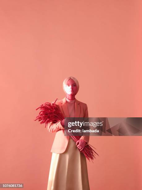 portrait of young woman in monochrome pink tones - arts culture et spectacles photos stock pictures, royalty-free photos & images